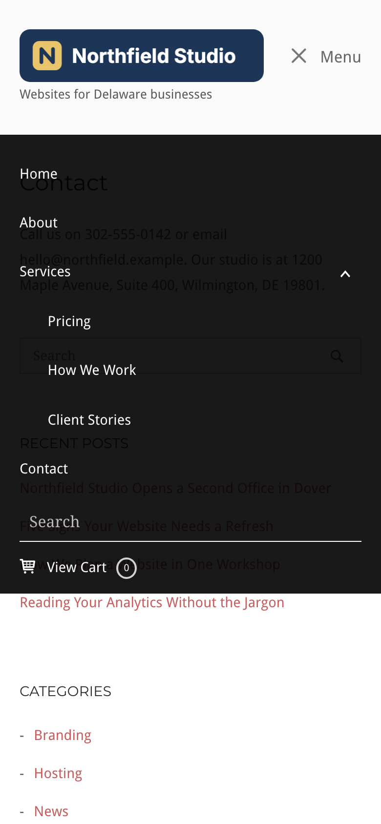 The mobile menu open on a phone with the Services sub menu, search field and cart link