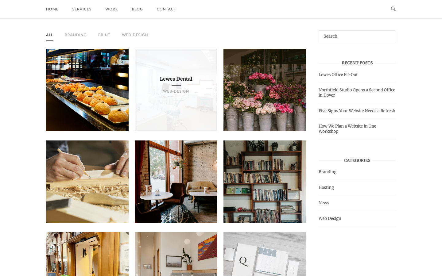 The portfolio grid with filter buttons and a project title on hover